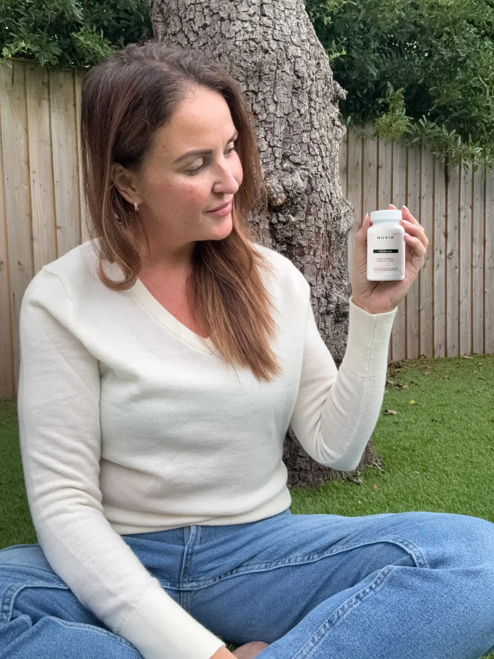 Nuvia review UK - customer holding bottle (testimonial)